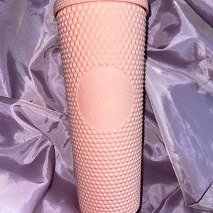 Pink studded Starbucks cup